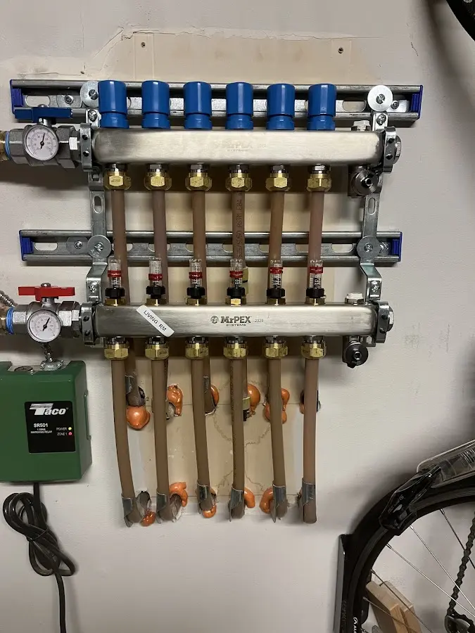 Plumber performing Water Heater Repair at a residential property in Clover